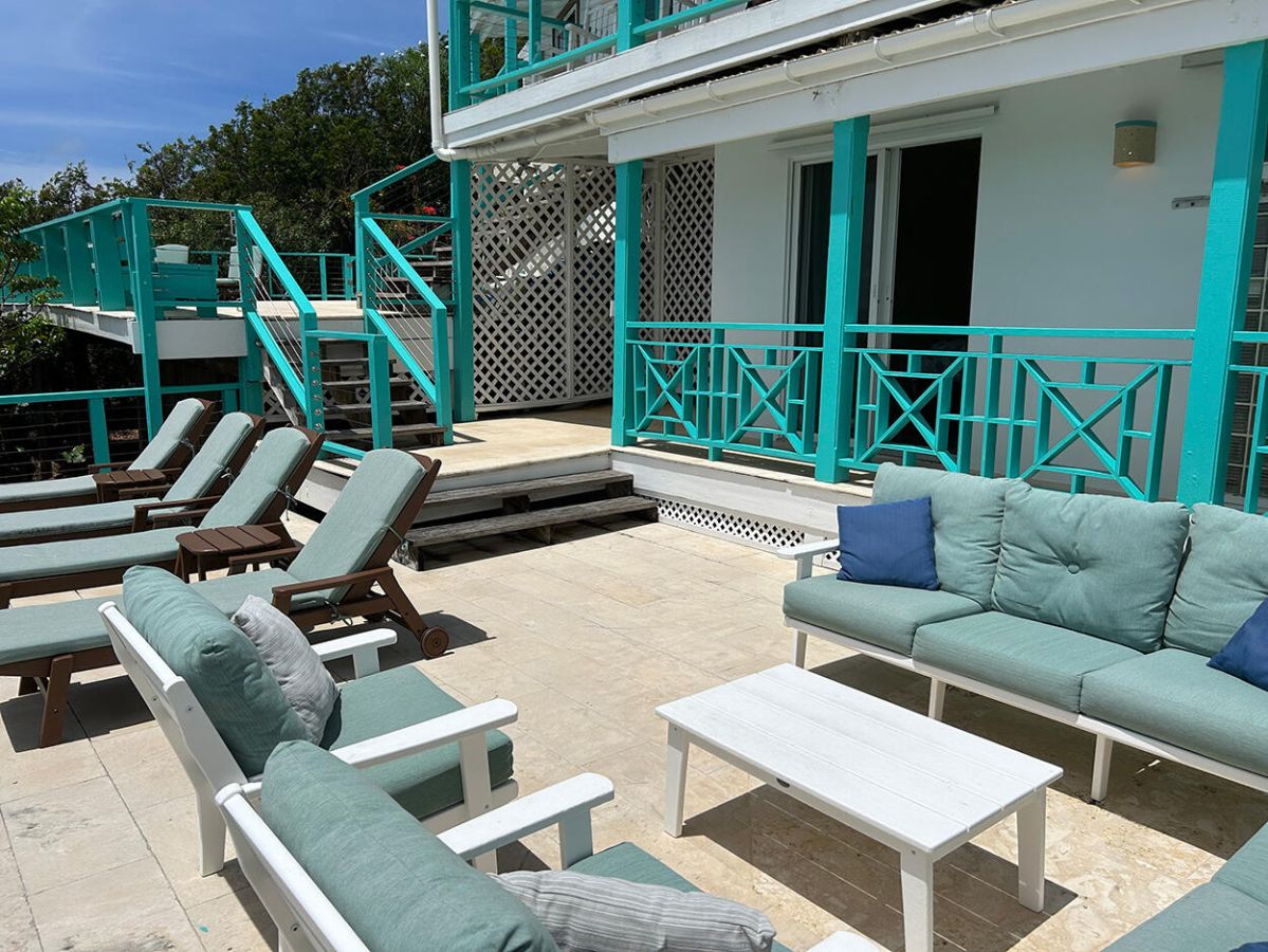Reef Break Vista patio with pool and sunset views