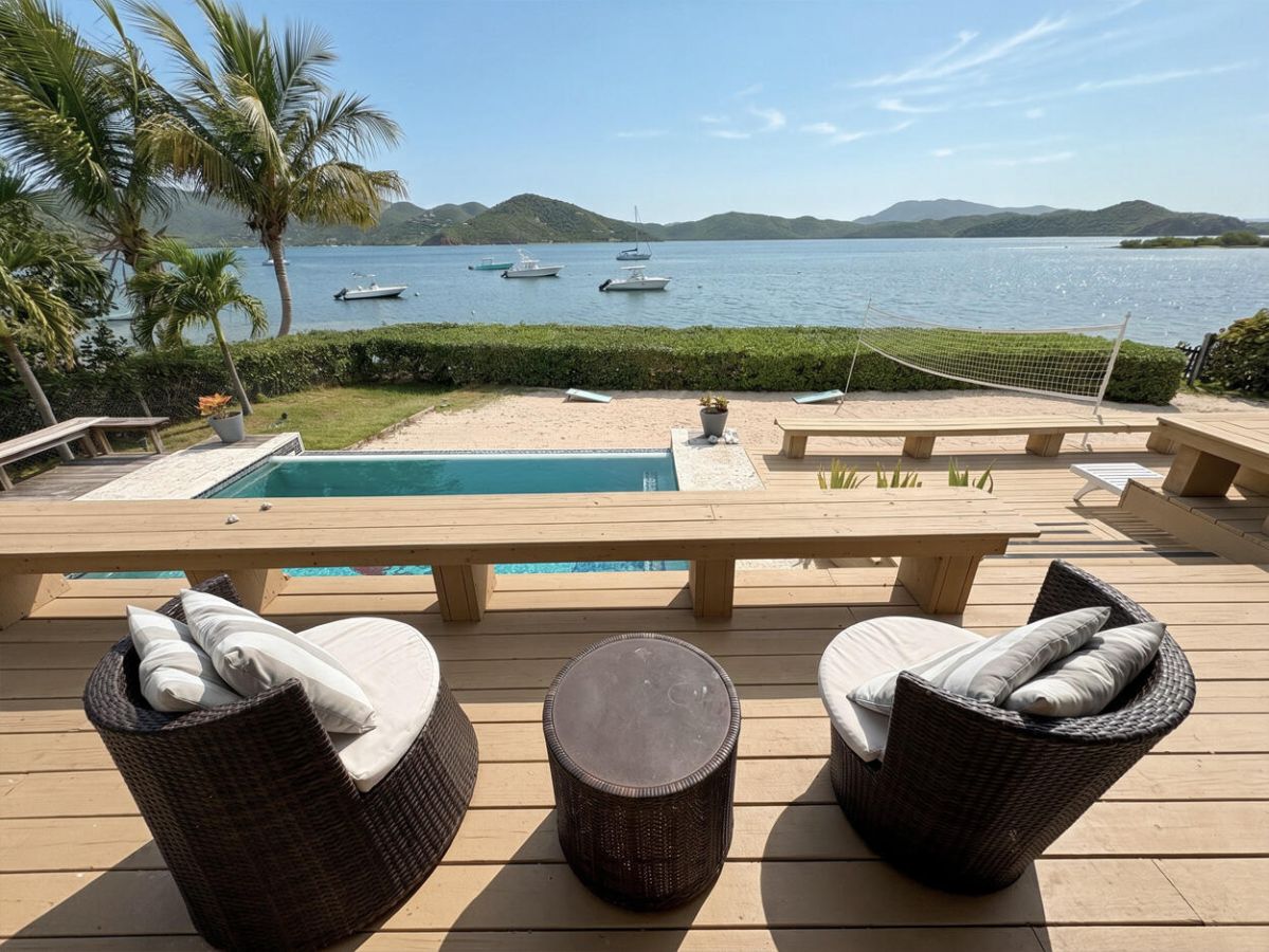 Seaside Breeze patio with pool and sunset views