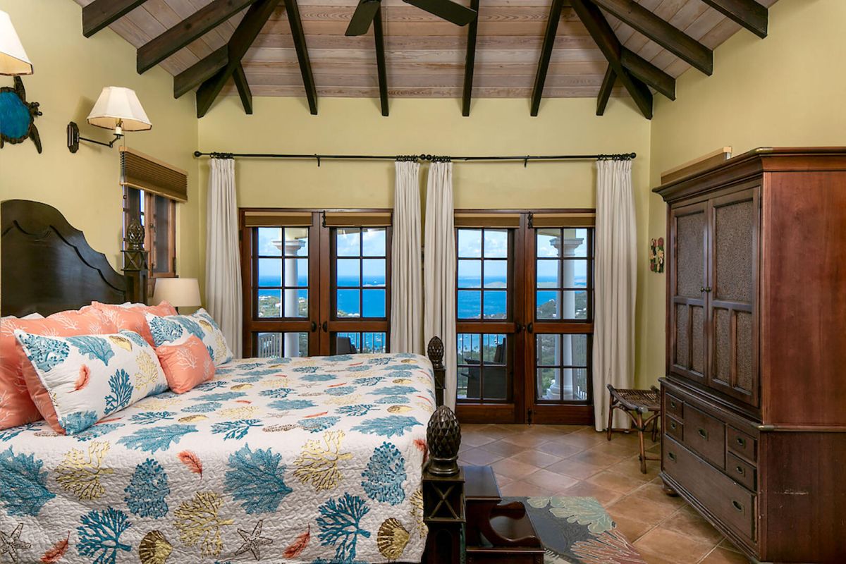 Vista Caribe patio with pool and sunset views